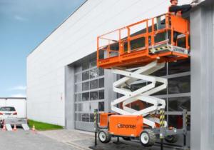 Snorkel Narrow Rough Terrain Scissor Lift being used.